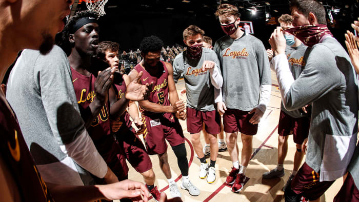 Loyola Chicago basketball gathers in a huddle